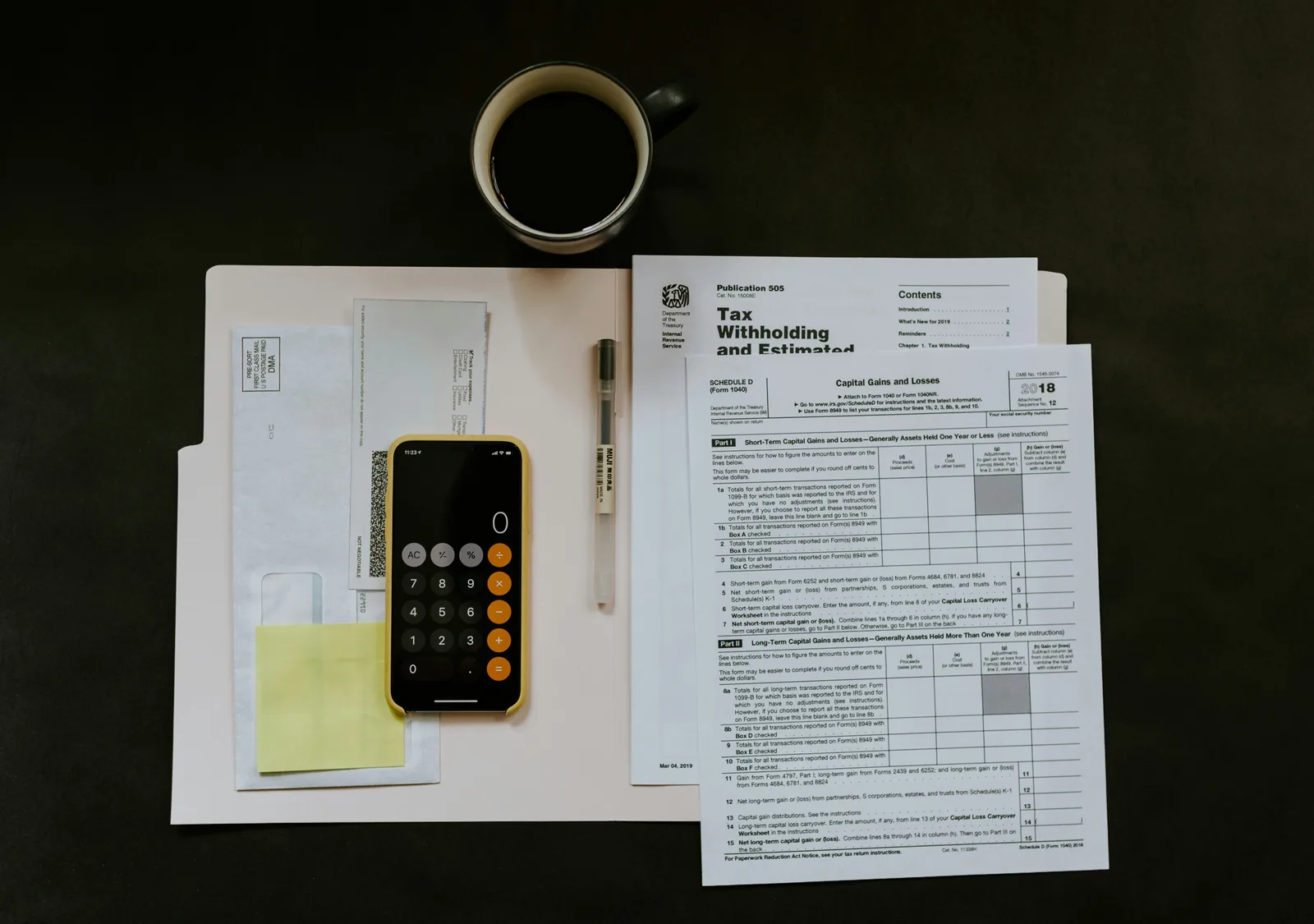 Dental practice payroll paperwork and financial documents spread across a desk before using Claude AI