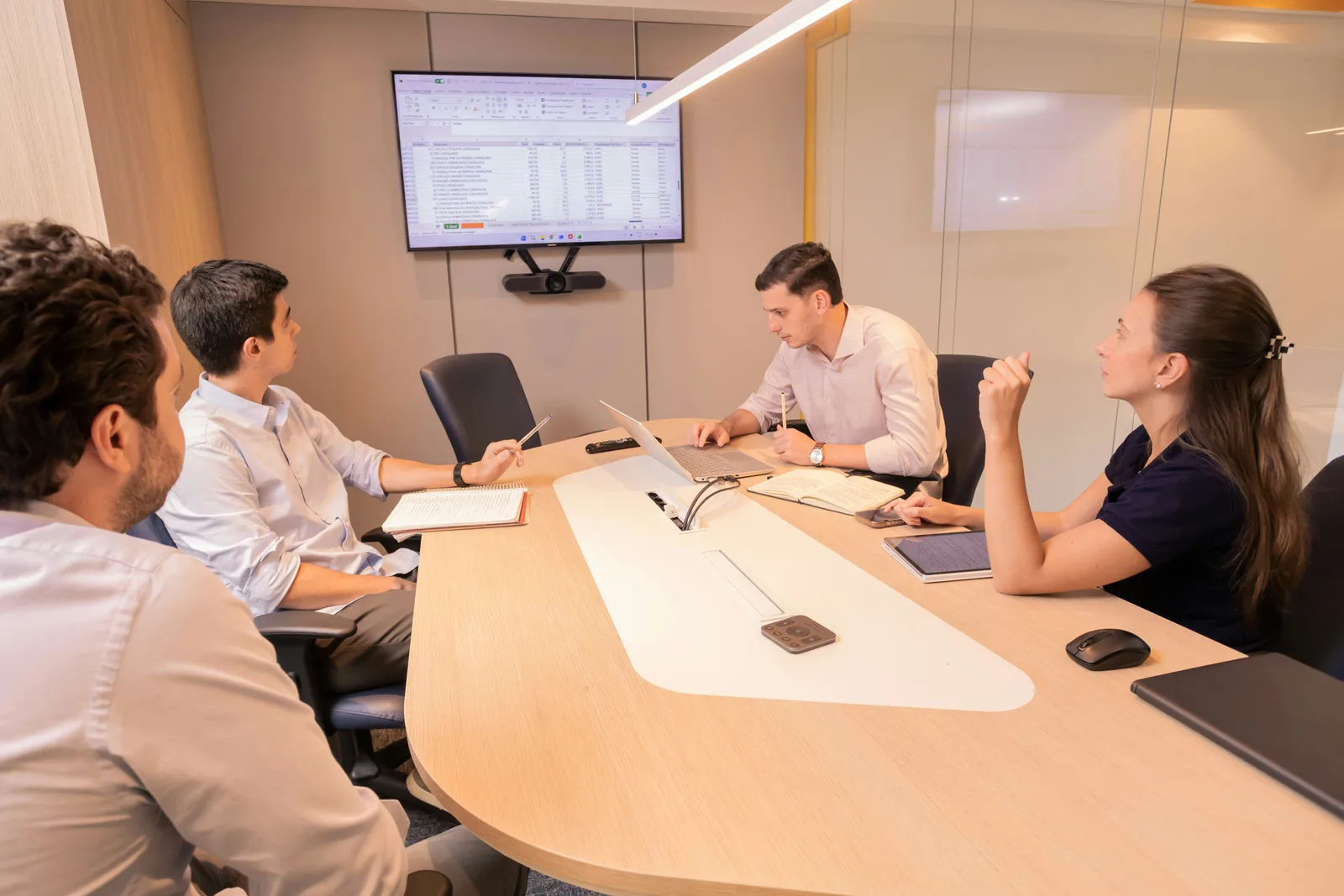 Dental practice team reviewing operations documentation and workflows with AI assistance